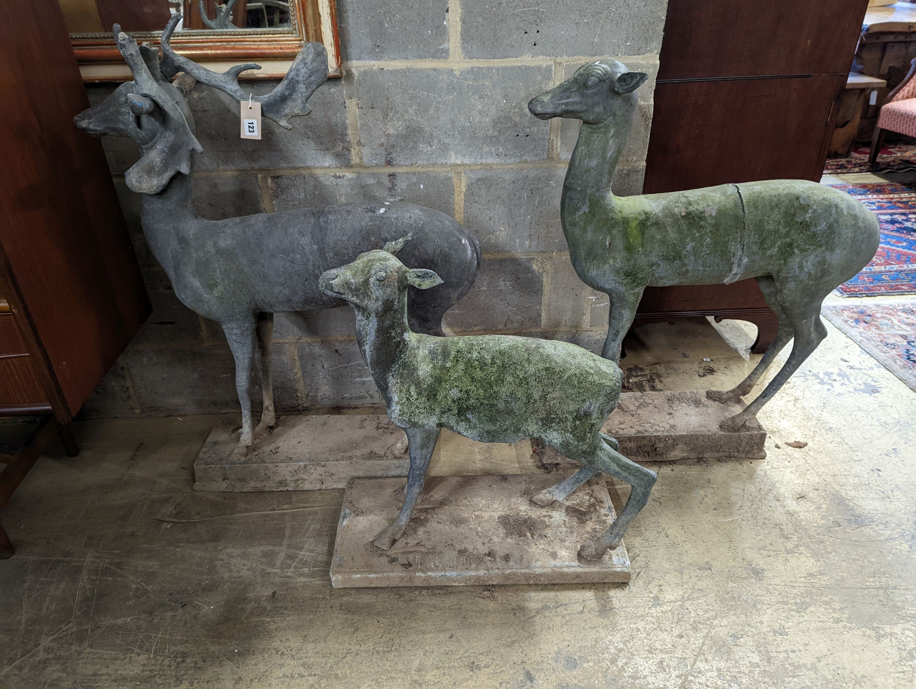 Three lead garden statues modelled as deer, largest height 105cm